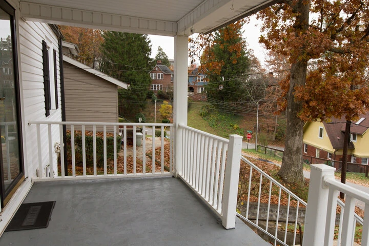 Custom-built residential porch designed for weather resistance and enhanced curb appeal.