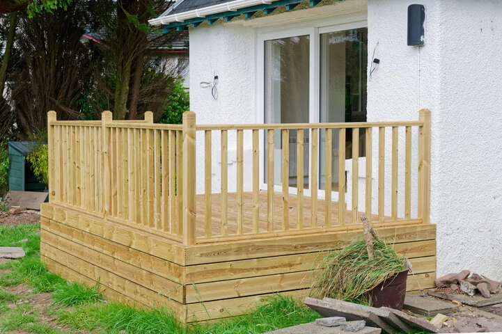 Freestanding ground-level floating deck installed to expand backyard outdoor space.