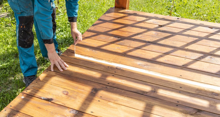 Skilled deck contractors installing a custom deck with high quality craftsmanship
